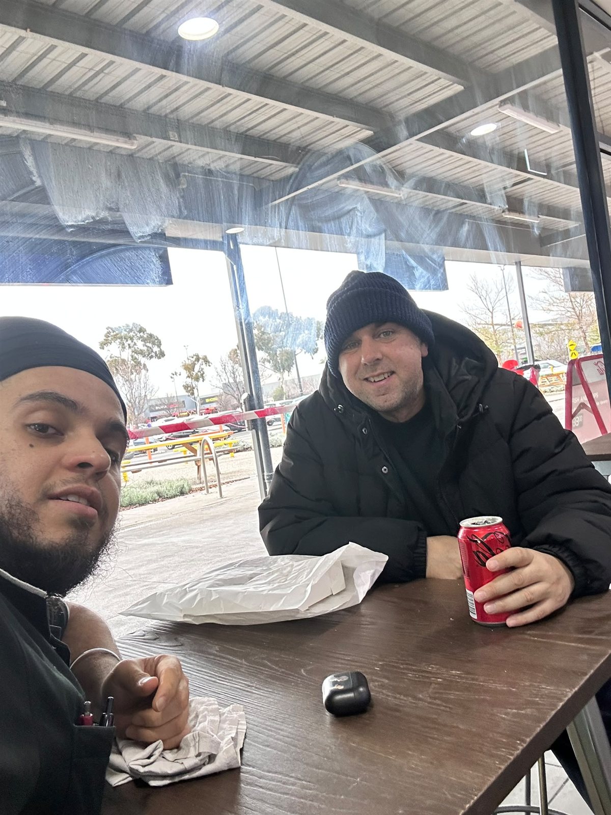 A Yours Truly participant and support worker catching up over a drink